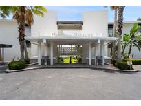 Maitland Harbour building entrance with lush landscaping at 1000 S Orlando Ave # A5, Maitland, FL 32751
