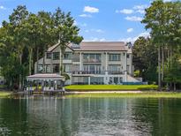 Luxury waterfront home with a private dock and stunning lake views at 9832 Laurel Valley Dr, Windermere, FL 34786