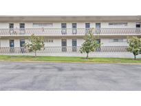 Exterior view of condo building with balconies and landscaping at 700 Melrose Ave # E4, Winter Park, FL 32789
