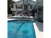 Inviting swimming pool with spacious deck at 24650 Fox Rd, Astor, FL 32102