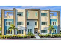 Modern building exterior with blue and gray accents at 7770 Sandy Ridge Dr # 227, Reunion, FL 34747