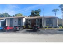 Front view of a two-story building with parking in front at 8 Escondido Cir # 78, Altamonte Springs, FL 32701