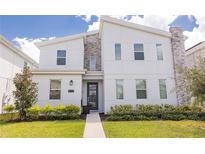 Modern two-story home with clean lines and stylish exterior at 4546 Narrative Ln, Kissimmee, FL 34746