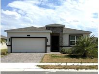 Modern one-story home with a two-car garage at 2927 Camden Way, Davenport, FL 33837