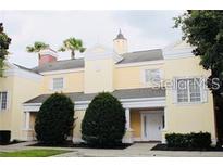 Elegant two-story townhouse with manicured landscaping at 1304 Seven Eagles Ct # 1304, Reunion, FL 34747
