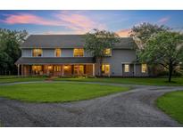 Two story house with large yard and circular driveway at 1709 Onondaga Dr, Geneva, FL 32732