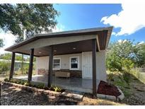 Inviting house exterior with covered porch at 1526 Lakewood Rd, Davenport, FL 33837