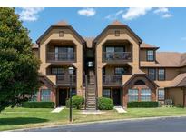 Two story townhome building with landscaping and parking at 320 Black Oak Ct # 107, Altamonte Springs, FL 32701