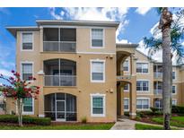 Building exterior showcasing residential units at 8100 Princess Palm Ln # 201, Kissimmee, FL 34747
