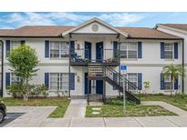 Two-story building with blue accents and balconies at 3651 N Goldenrod Rd # B107, Winter Park, FL 32792