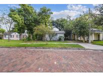Quaint bungalow home on a tree-lined street with brick sidewalks at 31 W Harding St, Orlando, FL 32806