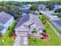 Aerial view of charming house with landscaped yard at 1669 Anna Catherine Dr, Orlando, FL 32828