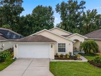 Attractive single-story home with a two-car garage and well-manicured landscaping at 726 High Vista Dr, Davenport, FL 33837