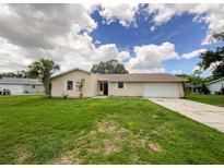 Charming ranch home with a well-maintained lawn at 3235 Cross Fox Dr, Mulberry, FL 33860