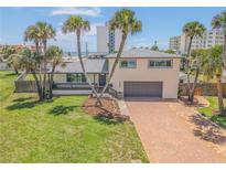 Two-story house with ocean view and brick driveway at 1232 Bel Aire Dr, Daytona Beach, FL 32118