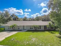 Single story home with a large front yard, and a neutral exterior color scheme at 601 Marlin Rd, Winter Springs, FL 32708