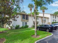 Two-story condo building with lush landscaping and ample parking at 200 Maitland Ave # 2, Altamonte Springs, FL 32701