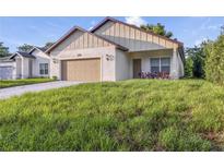 Two-car garage and front yard at 1930 Rogers Ave, Maitland, FL 32751