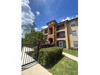 Three-story apartment building with balconies and landscaping at 5518 Metrowest Blvd # 207, Orlando, FL 32811