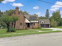 Charming brick house with a two-car garage at 1689 Lakeshore Dr, Eustis, FL 32726