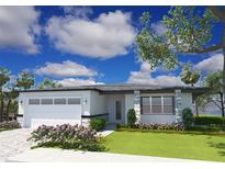 Single-story home with two-car garage and lush landscaping at 2665 Trafalgar Blvd, Kissimmee, FL 34758