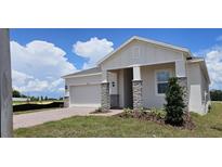 Single-story home with stone accents at 6804 Serpent Hawk Lane St, Howey In The Hills, FL 34737
