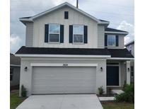 Two-story home with gray siding and dark accents at 3630 Sagefield Dr, Harmony, FL 34773