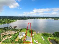 Lakefront property with city skyline view at 33 S Ortman Dr, Orlando, FL 32805