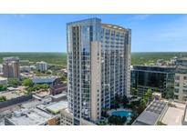 High-rise building with a rooftop pool and city views at 155 S Court Ave # 2208, Orlando, FL 32801