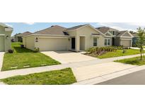 One-story home with attached garage and landscaping at 4278 Green Gables Pl, Kissimmee, FL 34746