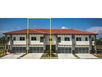 Three-unit townhome building with modern design and attached garages at 1815 Brentwood Ct, Davenport, FL 33837