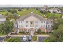 Luxury condo building with golf course views at 7673 Heritage Crossing Way # 101, Reunion, FL 34747