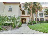 Condo building with palm trees and landscaping at 823 Camargo Way # 101, Altamonte Springs, FL 32714