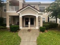 Two-story building exterior with inviting entryway and landscaping at 2323 Arbor Lakes Cir # 2323, Sanford, FL 32771