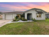 Newly renovated single story home with landscaped front yard at 166 La Paz Dr, Kissimmee, FL 34743