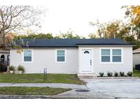 Newly renovated single story home with a modern exterior and landscaped yard at 2070 W Airport Blvd, Sanford, FL 32771