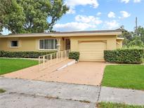 Ranch style home with attached garage at 6809 Ambassador Dr, Orlando, FL 32818