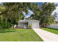 Single story home with carport and fenced backyard at 1213 Nela Ave, Orlando, FL 32809