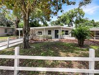 Updated house exterior with a carport and well-manicured lawn at 613 Alpine St, Altamonte Springs, FL 32701