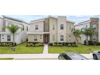 Modern two-story home with stone and light-colored siding at 1158 Drop Ln, Davenport, FL 33896