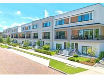 Modern townhouses with brick pavers and landscaping at 42 W Harding St # B, Orlando, FL 32806