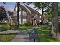 Two-story townhome with landscaping and walkway at 3383 Westchester Square Blvd # 204, Orlando, FL 32835