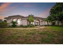 Beautiful one-story home with tile roof and landscaping at 445 Hightower Dr, Debary, FL 32713