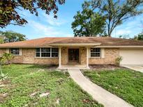 Brick, single-story home with a covered entryway at 509 Savona Ct, Altamonte Springs, FL 32701
