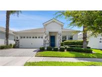 Charming one-story home with gray stone accents at 1411 Clubman Dr, Davenport, FL 33896