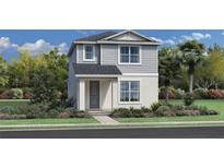 Two-story home with gray siding and landscaping at 2476 Cedar Rose St, Apopka, FL 32712