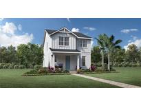 Two-story home with gray roof, white siding, and blue door; landscaped yard at 2480 Cedar Rose St, Apopka, FL 32712