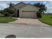 One-story home with a two-car garage and landscaped yard at 2470 Salzburg Loop, Winter Haven, FL 33884
