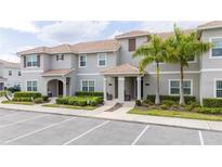 Three-story townhouses with parking and landscaping at 4837 Dedication St, Kissimmee, FL 34746