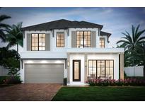 Two-story house with a modern design and a gray garage door at 6 W Hazel St, Orlando, FL 32804